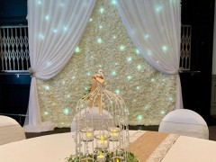 flower-wall-backdrop-and-birdcage-centrepiece
