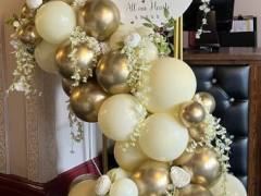 gold-frame-with-balloon-garland-and-sign