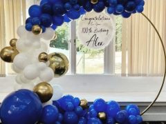 gold-hoop-with-balloon-garland-and-personalised-sign
